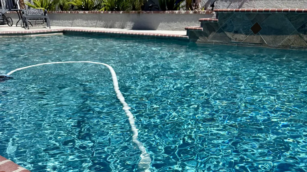 Weekly pool service cost in Riverside, CA shown at a clean backyard pool
